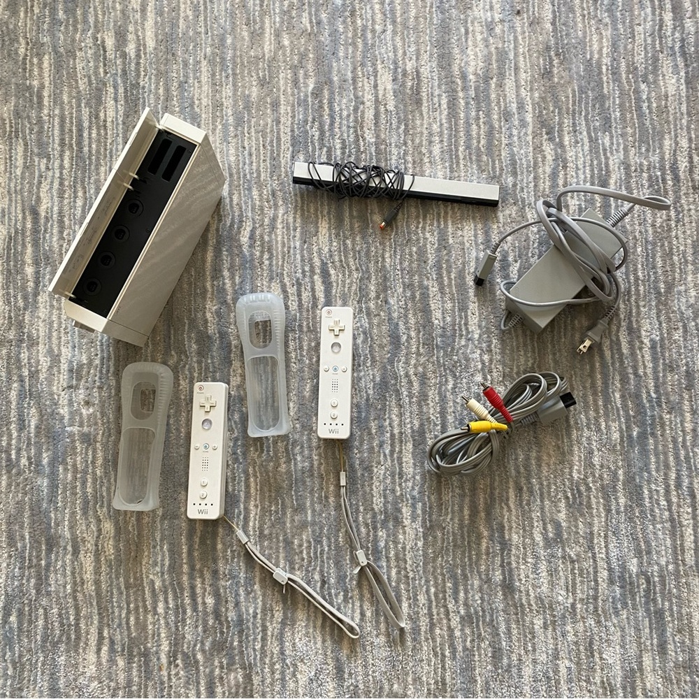 Wii console LIKE NEW and 2 controllers with protectors